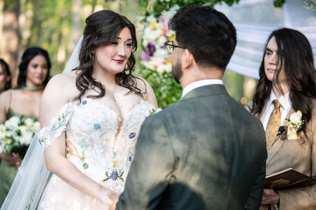 Bride smiles at groom