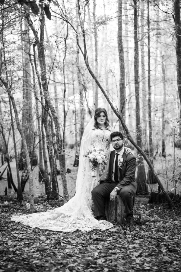 Wedding portrait of bride and groom in swampy area of Slidell