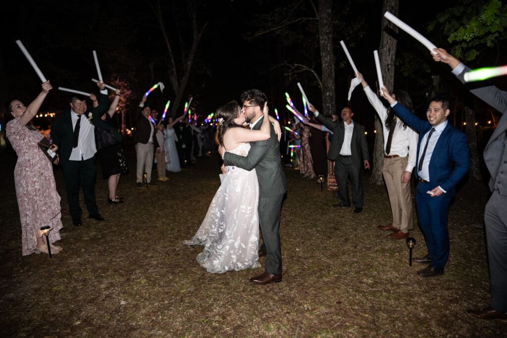 Bride and groom kiss during send-off
