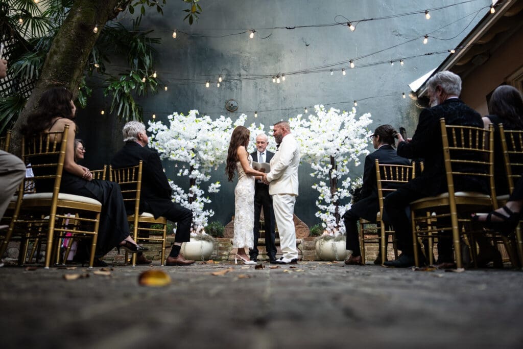 Wedding ceremony in St. Ann Cottage courtyard
