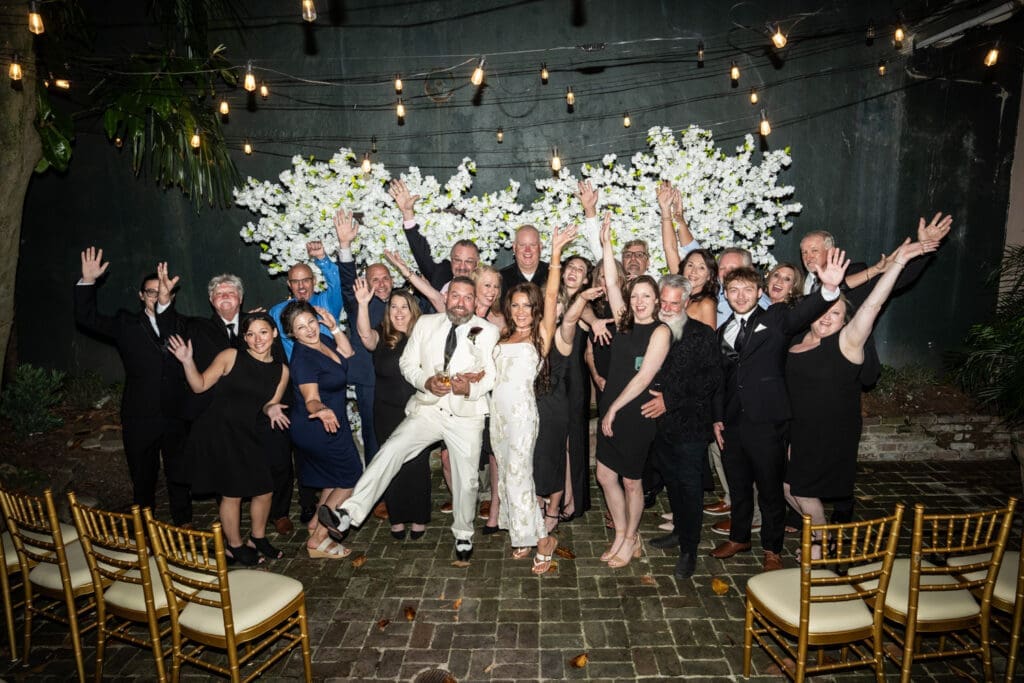 Bride and groom celebrating with guest