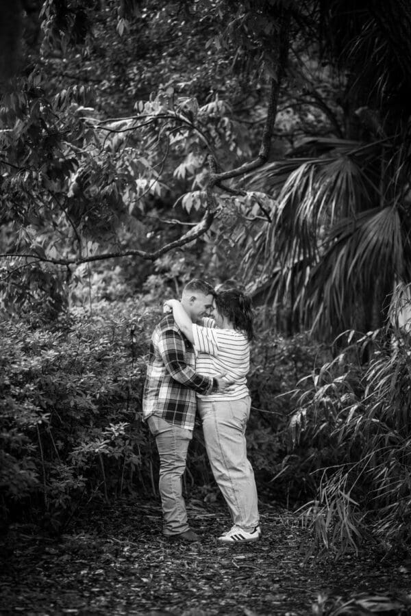 Couple embracing in quiet area of park