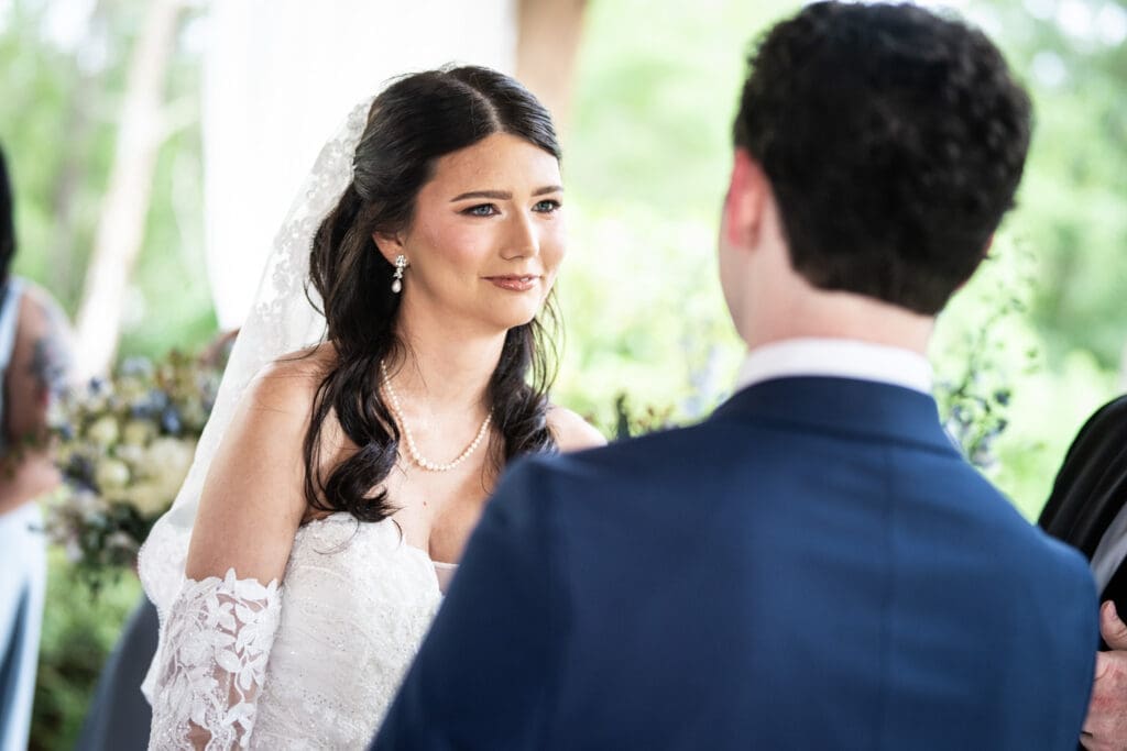 Bride smiles at groom