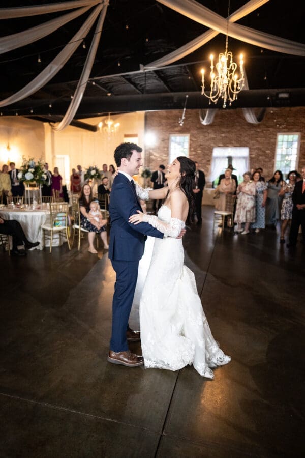 Bride and groom laugh during first dance at Dogwood Venue