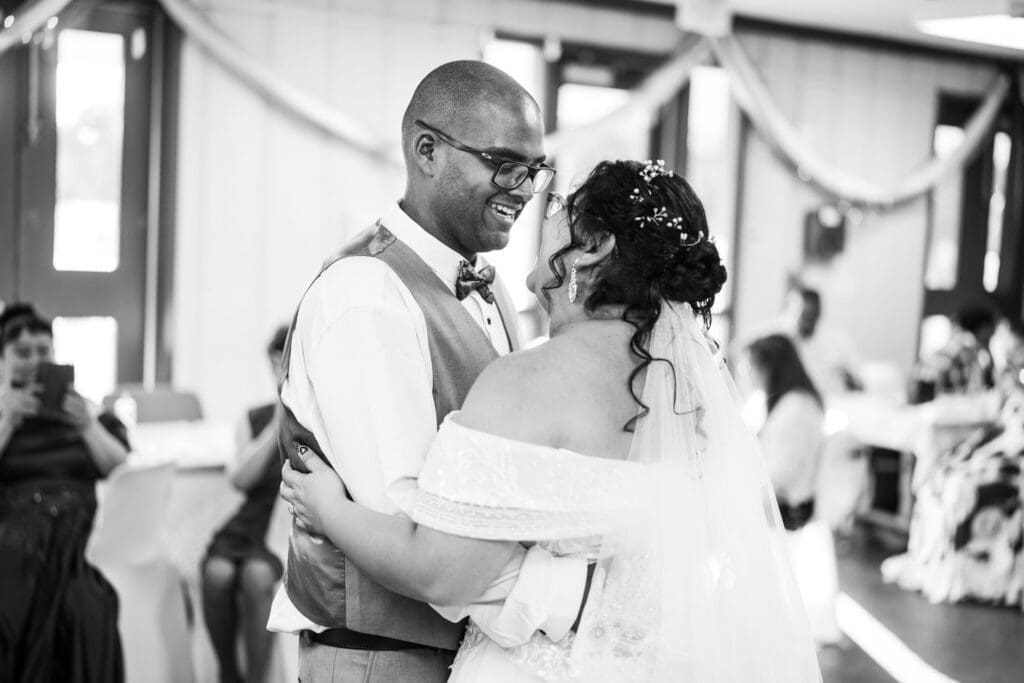 Couple smiles at each other during first dance