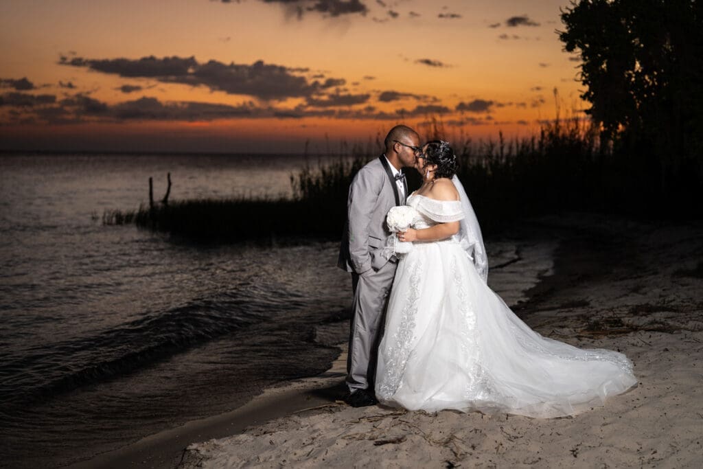 Couple kissing with sunset at Fontainebleau State Park