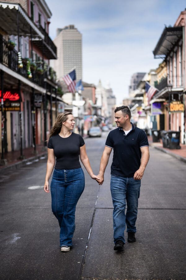 Couple walking down Bourbon Street