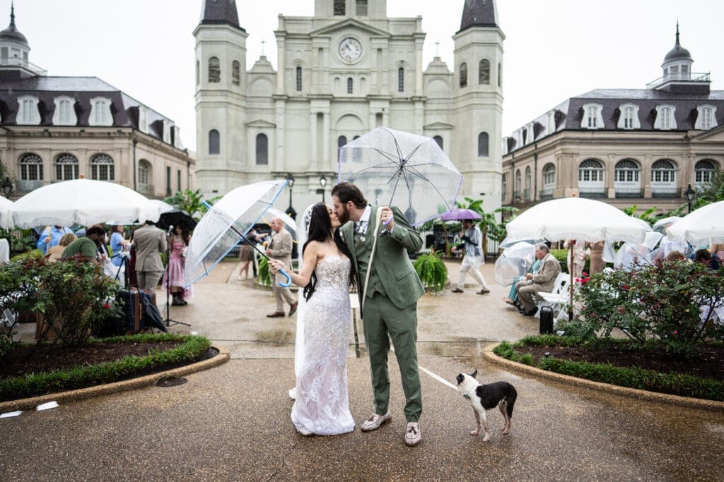 Bride and groom kissing at conclusion of Jackson Square wedding ceremony