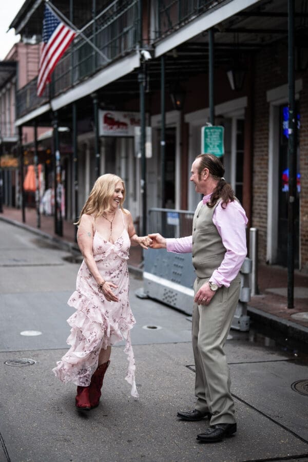 Couple dancing in the middle of Bourbon Street
