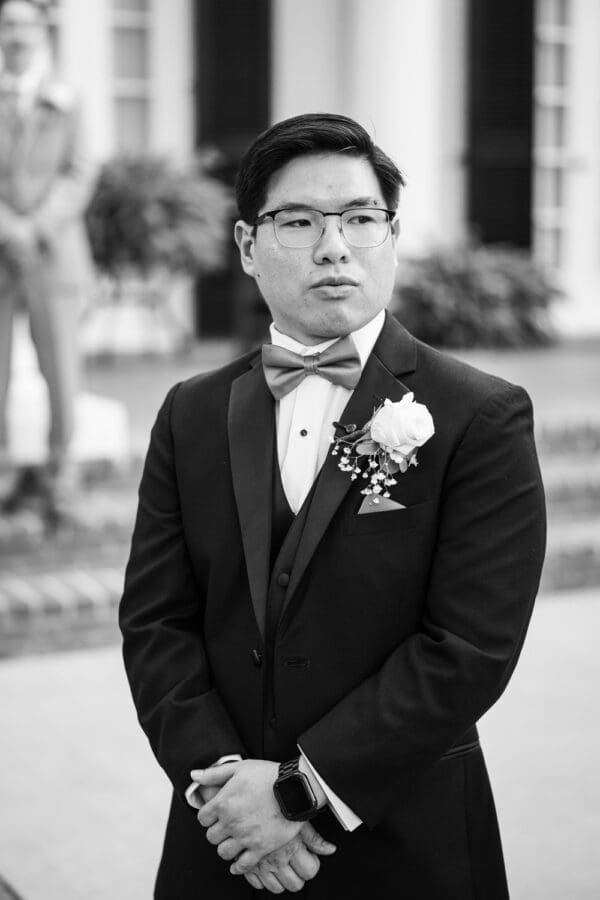 Groom watches bride walk up the aisle