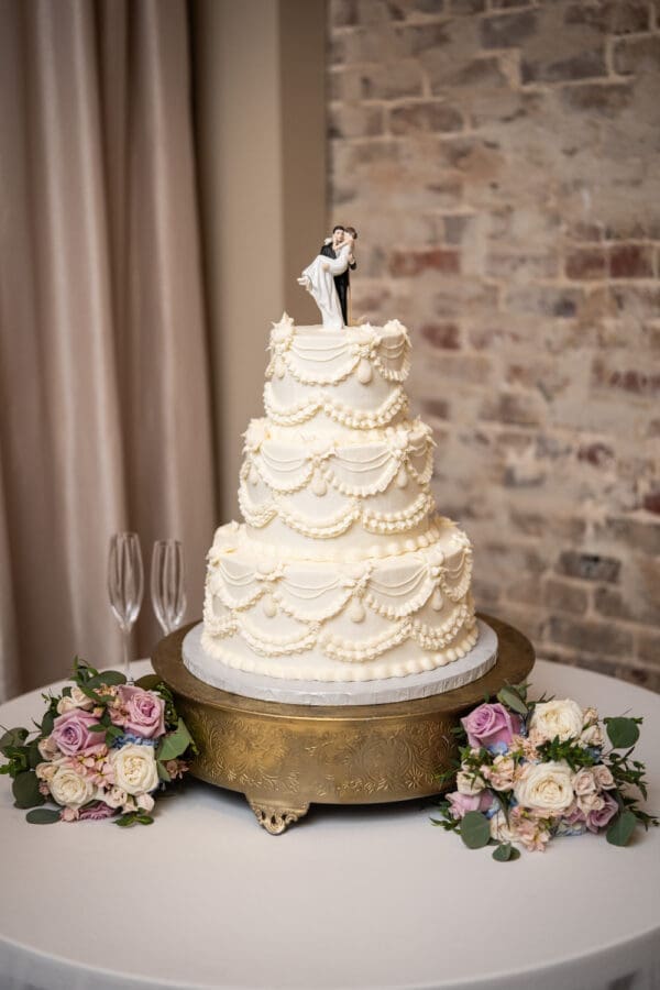 Wedding cake on table with flowers