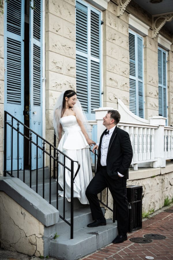 Couple standing on front steps of French Quarter home