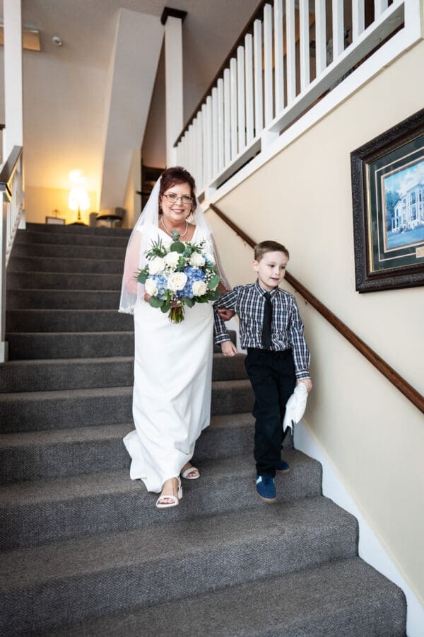 Bride walks down stairs