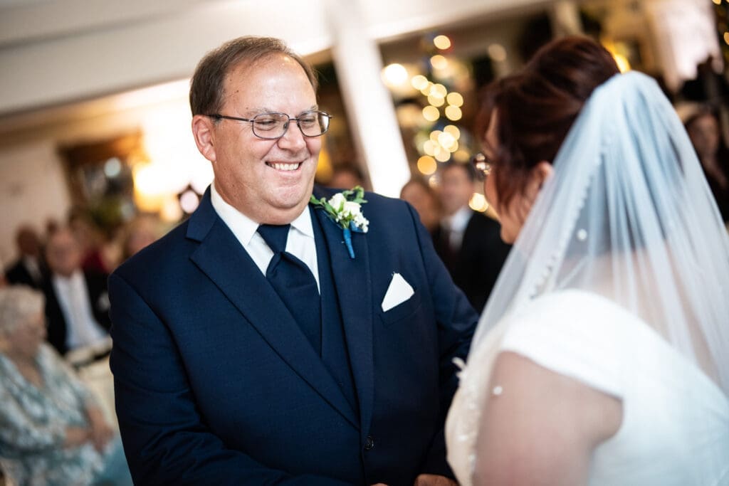 Groom looks at bride