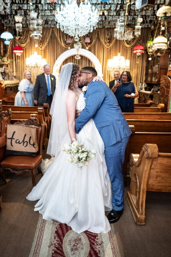Bride and groom kiss at French Quarter wedding chapel