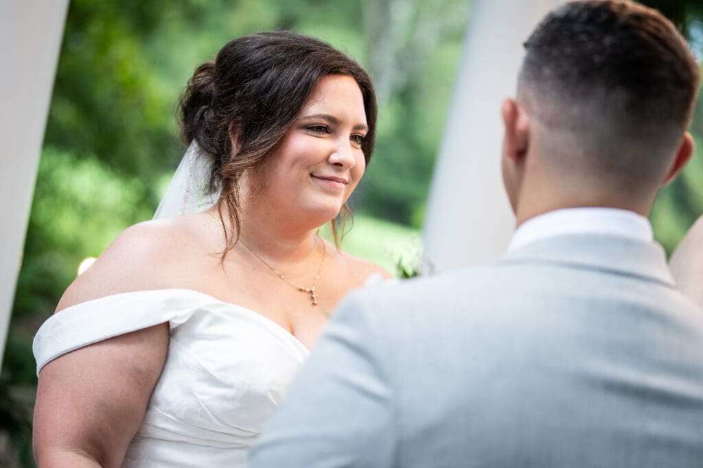 Bride smiles at groom