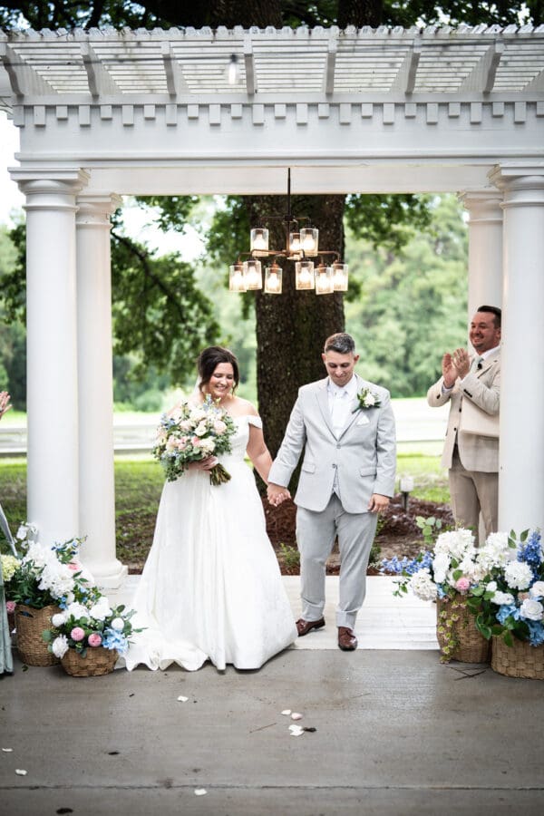Bride and groom smile at conclusion of wedding ceremony