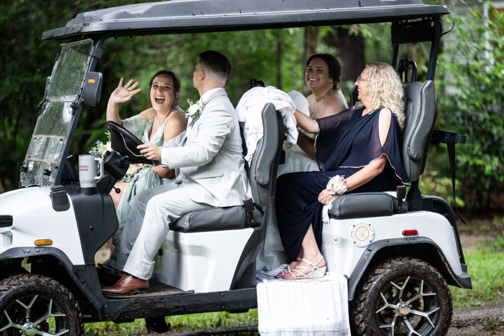 Bride and groom in golf cart