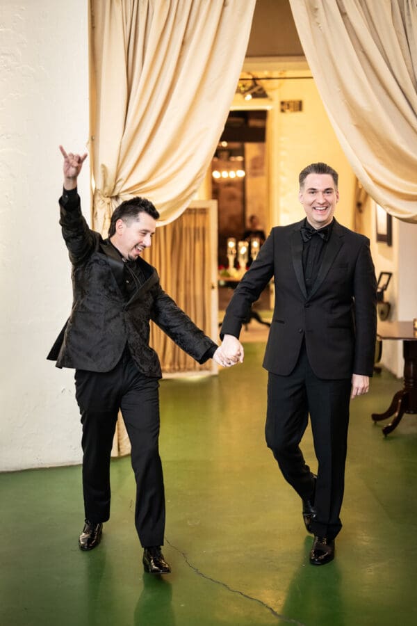 Grooms make entrance into reception
