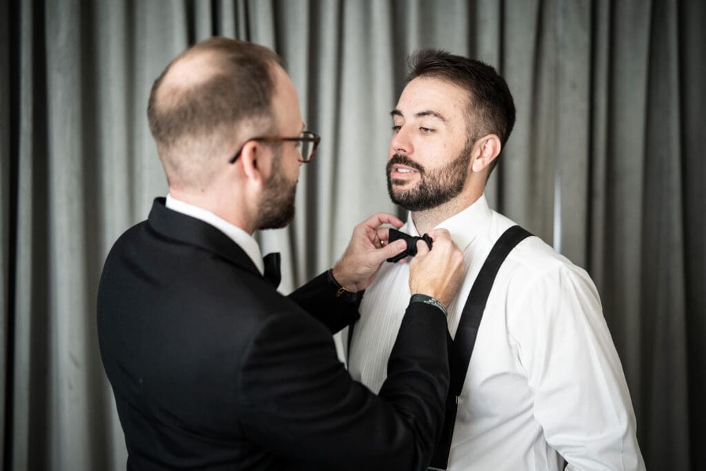Best man fixes groom's tie