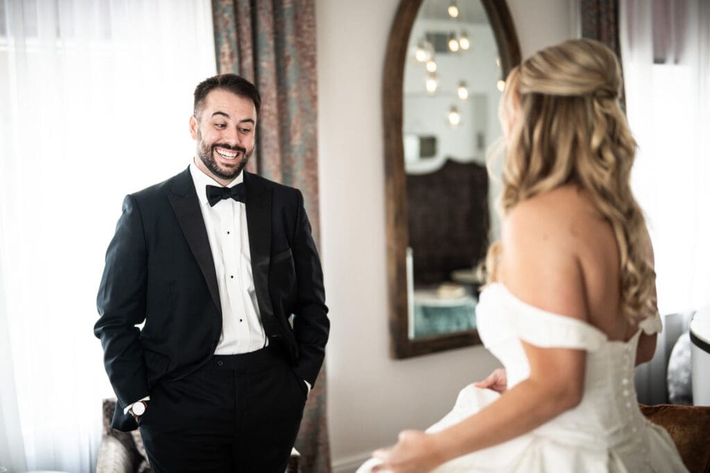 Groom sees bride during first look