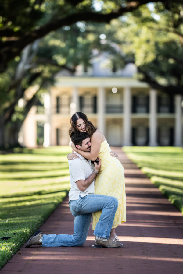 Woman hugs boyfriend after he proposes