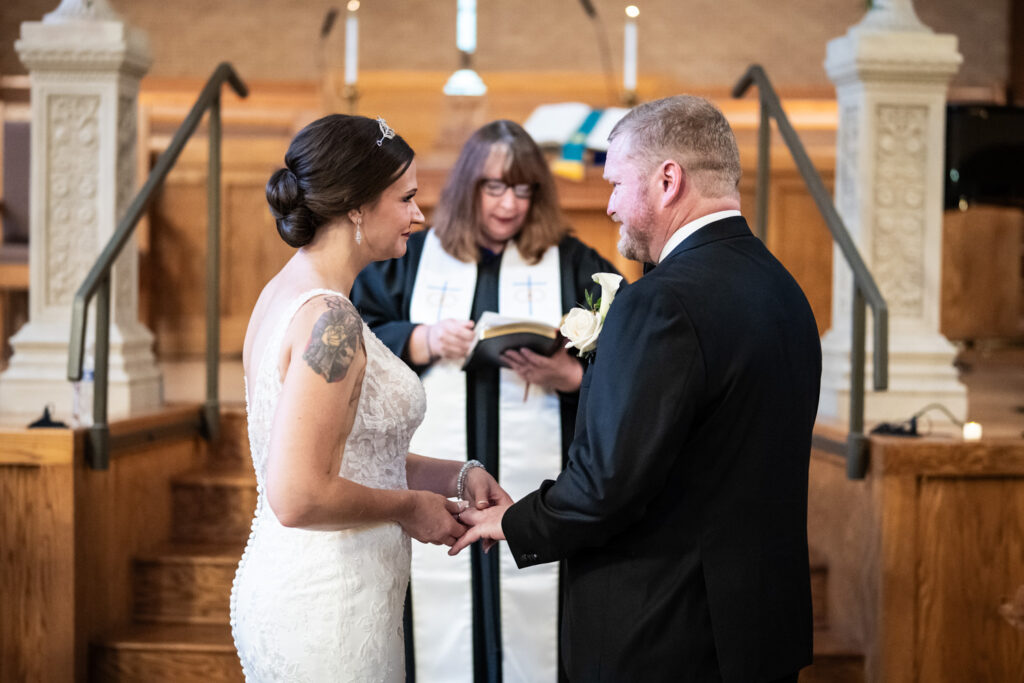 Bride and groom exchange rings