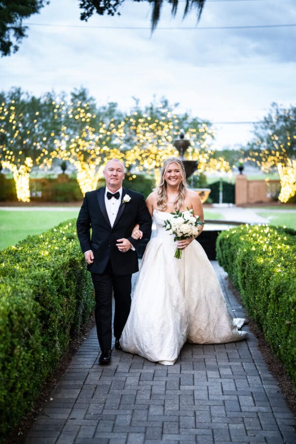 Bride and father walk up the aisle