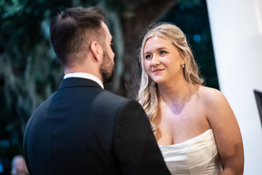 Bride smiles at groom