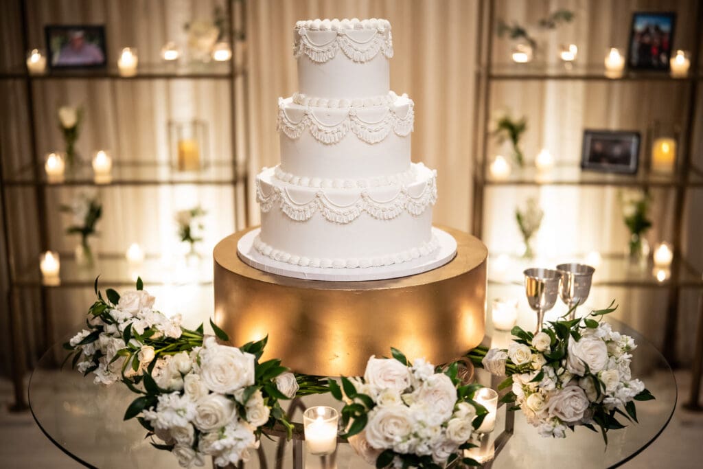 Wedding cake on table with flowers