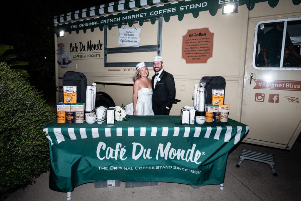 Bride and groom in front of Cafe du Monde truck